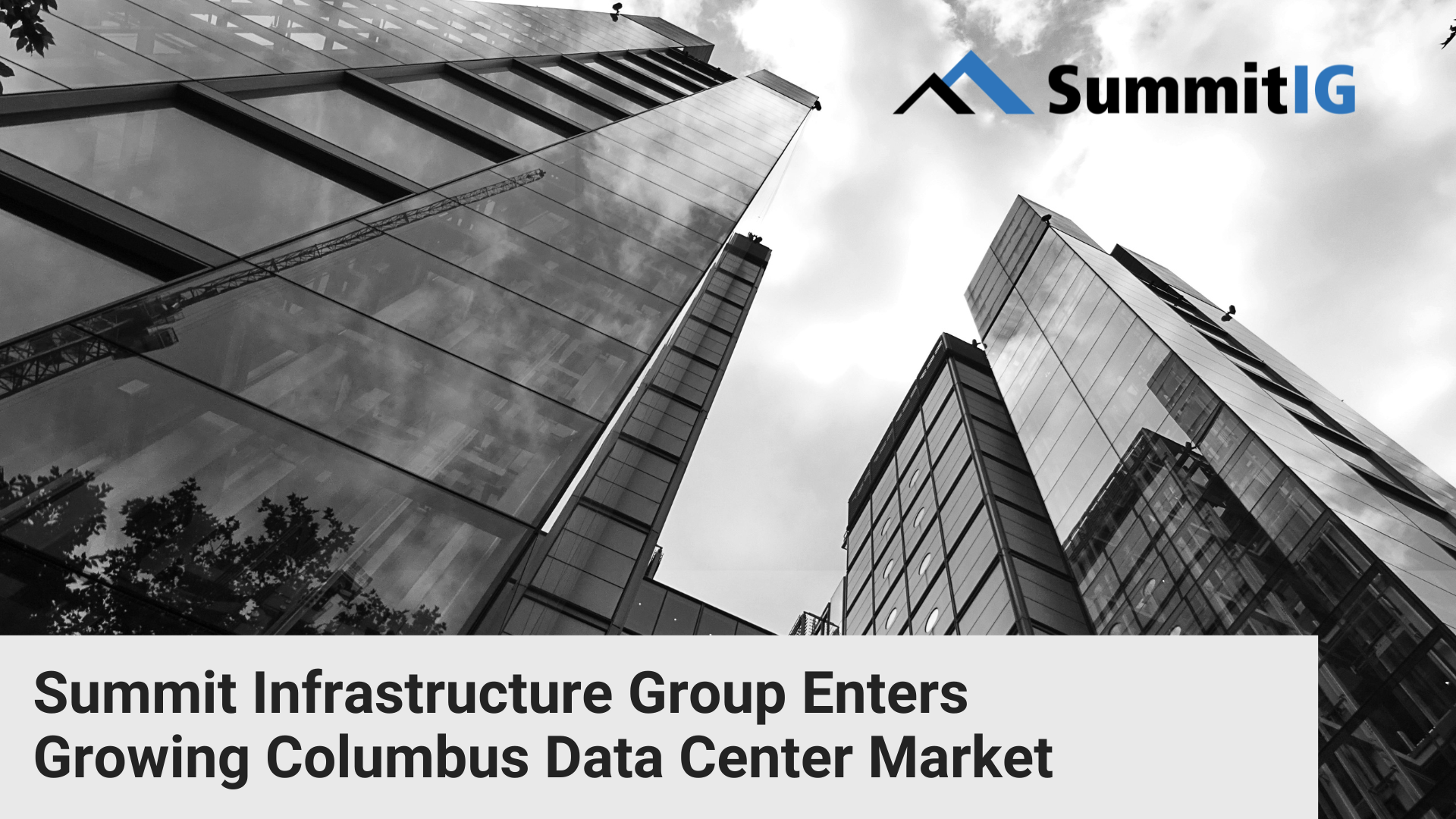 looking up at tall buildings from the street, with SummitIG logo, provider of dark fiber infrastructure